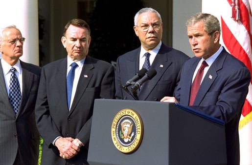 President George W. Bush announces a new Mother and Child HIV Prevention Initiative in the Rose Garden June 19. Standing by the President from, left to right, are Secretary of Treasury Paul O'Neill, Secretary of Health and Human Services Tommy Thompson and Secretary of State Colin Powell. White House photo by Tina Hager.