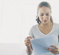 Photo of a woman holding some papers