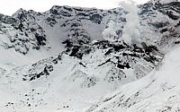 Aerial view of the snow-covered lava dome in crater of Mount St. Helens, Washington