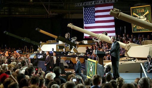 President George W. Bush addresses employees of the Lima Army Tank Plant, where the Abrams M1A2 tank is built, in Lima, Ohio, April 24, 2003. "I'm here to thank you all for your service to our country, and thank you for the vital contribution you have made to peace and freedom," said the President in his remarks. "And each of you have had a part in this mission. Each of you are a part to making sure this country is strong enough to keep the peace." White House photo by Paul Morse.