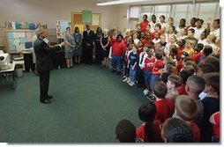 President George W. Bush is greeted by students at Hyde Park Elementary School in Jacksonville, Fla., Tuesday, Sept. 9, 2003. White House photo by Tina Hager.