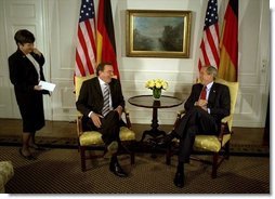 President George W. Bush talks with German Chancellor Gerhard Schroeder during a series of United Nations meetings with world leaders in New York Wednesday, Sept. 24, 2003. After the meeting, the two leaders addressed the media. "We're both committed to freedom; we're both committed to peace; we're both committed to the prosperity of our people," said President Bush. White House photo by Paul Morse.