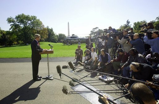 President George W. Bush discusses the Iraq report with the press on the South Lawn Thursday, Oct. 7, 2004. White House photo by Eric Draper.