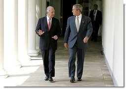 President George W. Bush and President Ricardo Lagos of Chile walk together along the colonnade at the White House Monday, July 19, 2004. White House photo by Paul Morse.