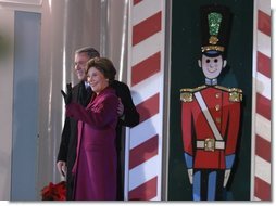 President George W. Bush and Mrs. Laura Bush arrive at the Pageant of Peace to light the National Christmas Tree at the Ellipse in Washington DC on Thursday December 4, 2003. White House photo by Paul Morse.