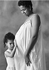Photo of pregnant woman and young child