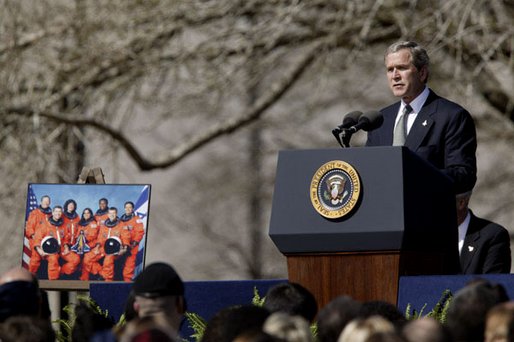 Speaking to the memory of the seven astronauts who lost their lives in Space Shuttle Columbia disaster, President George W. Bush addresses the nation's loss during a memorial service at the NASA Lyndon B. Johnson Space Center Tuesday, Feb. 4, 2003. "This cause of exploration and discovery is not an option we choose; it is a desire written in the human heart. We are that part of creation which seeks to understand all creation," said the President. "We find the best among us, send them forth into unmapped darkness, and pray they will return. They go in peace for all mankind, and all mankind is in their debt." White House photo by Paul Morse