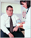 Overweight man talking to doctor