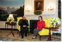 Laura Bush welcomes President Hamid Karzai of Afghanistan to the White House during a meeting in the Diplomatic Reception Room Thursday, Feb. 27, 2003. White House photo by Susan Sterner.