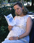Pregnant Woman reads brochure on pregnancy