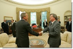 President George W. Bush meets with the Prime Minister David Oddsson of Iceland in the Oval Office Tuesday, July 6, 2004. White House photo by Eric Draper.