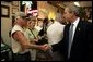 President George W. Bush visits with patrons of La Tropicana Café in Ybor City, Florida on Friday July 16, 2004. White House photo by Paul Morse.