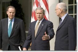 Accompanied by Chairman Thomas Kean, left, and Vice Chairman Lee Hamilton of the 911 Commission, President George W. Bush addresses the press during the presentation of the Commission's report in the Rose Garden Thursday, July 22, 2004.  White House photo by Eric Draper.