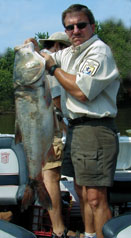Man holding large Asian carp