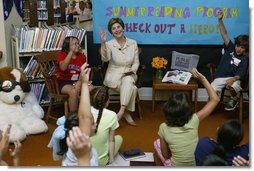Laura Bush discusses the importance of reading with children participating in the No Child Left Behind Summer Reading Program at the Portsmouth Public Library in Portsmouth, New Hampshire, Friday, July 9, 2004. White House photo by Joyce Naltchayan.