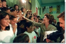 Laura Bush greets student of Morningside Elementary School after addressing the assembly in San Fernando, Calif., March 22, 2001. White House photo by Paul Morse.