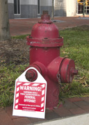 Fire Hydrant with warning sign