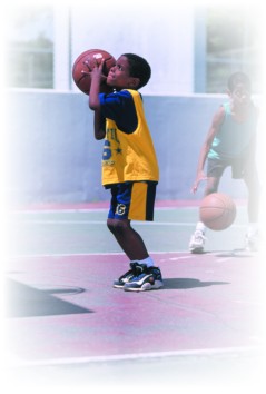 Image of boy playing basketball