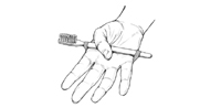 Illustration of making the toothbrush easier to hold using a rubber band or elastic
