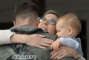 Pam, and son Ethan hug goodbye husband and father Maj. J.J., AV-8B pilot, who departed with Marine Attack Squadron 223 in support of the 26th Marine Expeditionary Unit (Special Operations Capable) March 5.
Photo submitted 03/13/2003 Taken by Pvt. Rocco DeFilippis
