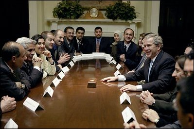 President George W. Bush meets with 25 Iraqi Fulbright Scholars in the Roosevelt Room Tuesday, Feb. 3, 2004. Reestablished in October of 2003, the Fulbright Program offers its scholarship recipients the opportunity to study at American universities.