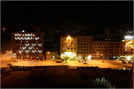 Buildings are illuminated and street lights are on in Baghdad April 22 2003, as power is restored in parts of the town.