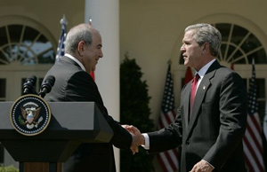 President George W. Bush shakes hands with Iraqi interim Prime Minister Ayad Allawi after their joint press conference in the Rose Garden Thursday, Sept. 23, 2004