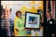 Laura Bush accepts a painting from Hunter Nelson, 14, a childhood cancer survivor, at the Opening Ceremony for the National Childhood Cancer Foundation's Gold Ribbon Days 2003. Mrs. Bush was the Keynote Speaker at the event, which is held annually to raise awareness and support of childhood cancer issues. Mrs. Bush offered her congratulations and support to patients, parents, doctors, nurses and medical researchers living and working every day to conquer the nation's #1 disease killer of America's children: cancer. The name of the event is derived from the Gold Ribbon, the symbol of childhood cancer awareness; the Opening Ceremony was held at the Reserve Officers Association in Washington, D.C.  White House photo by Susan Sterner
