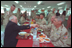 Stationed in Egypt, American troops are participating in an 11-country international peacekeeping force called the Multinational Force of Observers. Here, they share conversation and lunch with Vice President Dick Cheney during his visit to the base March 13. The MFO is an international peacekeeping force established by Egypt and Israel to monitor the security arrangements of their Treaty of Peace.