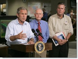 President George W. Bush delivers a live statement to Floridians affected by Hurricane Frances at the National Hurricane Center in Miami, Fla., Wednesday, Sept. 8, 2004. Also pictured from left are Max Mayfield Director of the National Hurricane Center and Florida Gov. Jeb Bush.  White House photo by Eric Draper.
