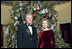 The 1998 Clinton tree was based on the theme 'A Winter Wonderland.' The tree featured fabric snowmen ornaments, knitted mittens and hats, and painted wooden ornaments. 