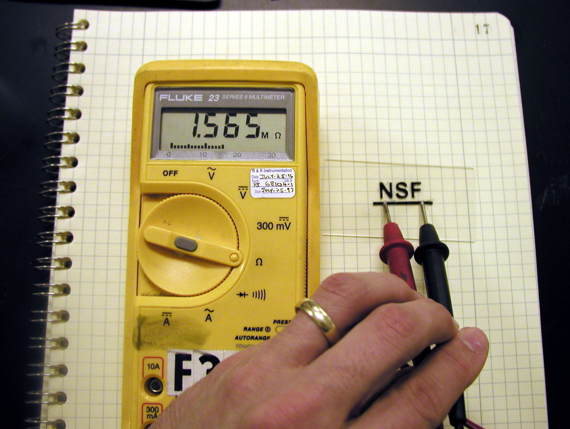 Demonstrating the conductivity of the photoprinted "NSF" image