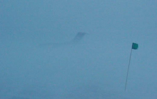 Photo of barely visible plane