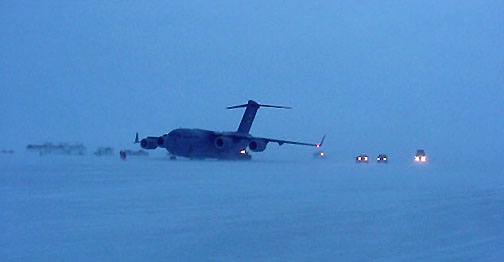 Photo of plane and other vehicles on the ice