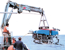 Image- Research scientists lowering the deep sea  explorer 
