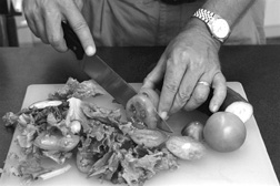 Photo of a man slicing vegetables