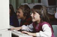image- girl with headphones at the  computer