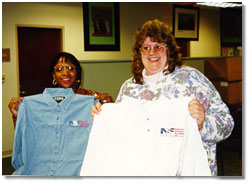 NSF staff members receive their NSF50 denim shirts.