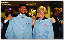 NSF staff members receive their NSF50 denim shirts.